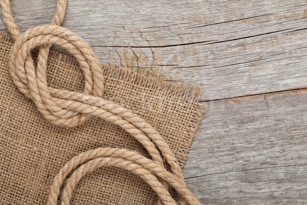 Ship rope on wooden texture background Stock photo © karandaev