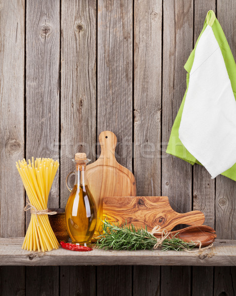 Stock photo: Kitchen utensils, herbs and spices on shelf