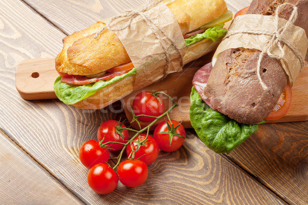 Two sandwiches with salad, ham, cheese Stock photo © karandaev