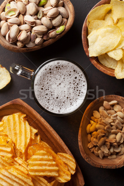 Stock photo: Lager beer and snacks on stone table