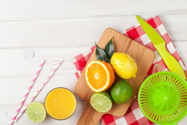 Citrus fruits and glass of juice. Oranges, limes and lemons Stock photo © karandaev