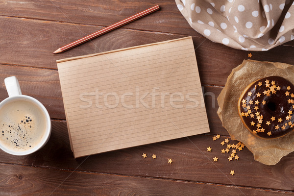Notepad, donuts and coffee on wooden table Stock photo © karandaev