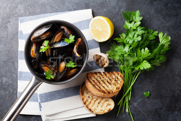 Mussels and bread toasts Stock photo © karandaev