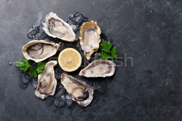 Oysters and lemon Stock photo © karandaev