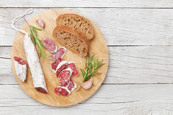 Sliced salami on cutting board Stock photo © karandaev