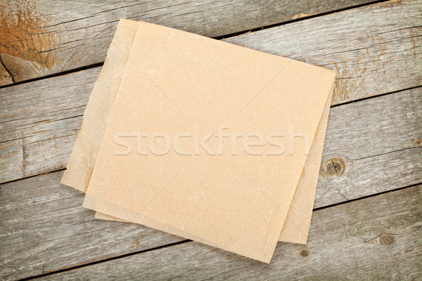 Cooking paper over wooden table Stock photo © karandaev