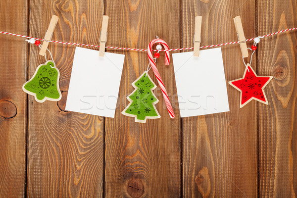 Photo frames and christmas decor on rope Stock photo © karandaev