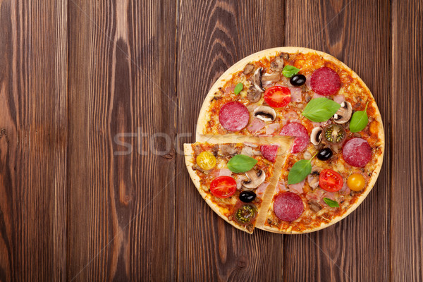 İtalyan pizza pepperoni domates zeytin fesleğen Stok fotoğraf © karandaev