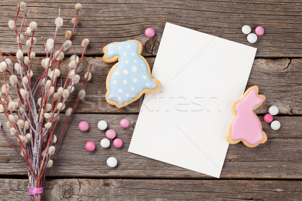 Pascua pan de jengibre cookies tarjeta de felicitación mesa de madera colorido Foto stock © karandaev