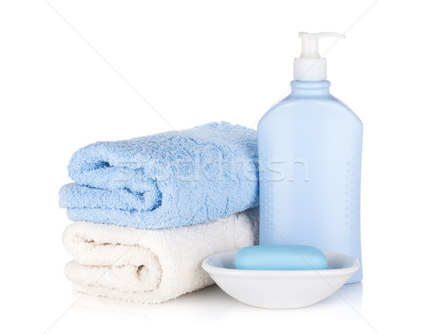 Shampoo bottle and soap with towels Stock photo © karandaev