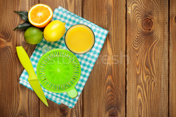 Citrus fruits and glass of juice Stock photo © karandaev