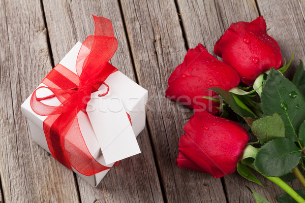 Valentines day gift box and red roses Stock photo © karandaev