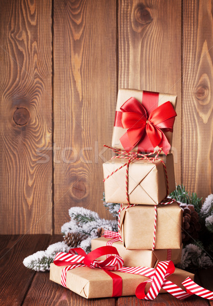 Stock photo: Christmas gift boxes and tree branch