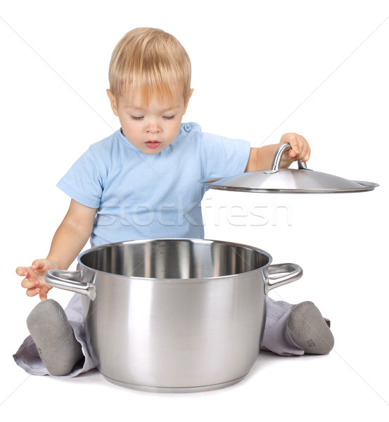Baby looking inside saucepan Stock photo © karandaev