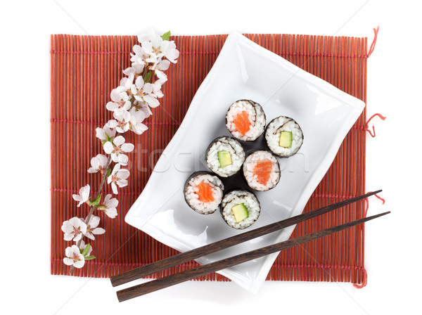 Sushi maki set with salmon and cucumber and sakura branch Stock photo © karandaev