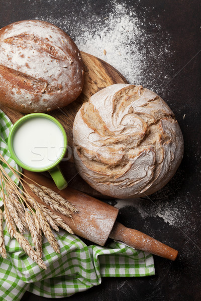 Various crusty bread and cup of milk Stock photo © karandaev