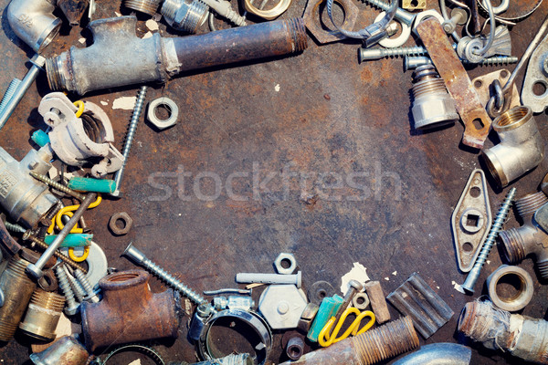 Workbench metal table with old water supply parts Stock photo © karandaev