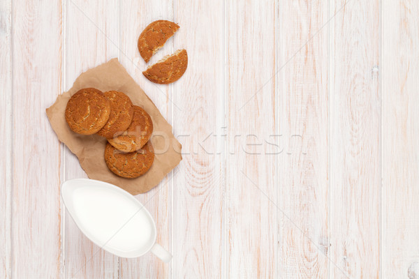 Stock photo: Milk pitcher and gingerbread cookies