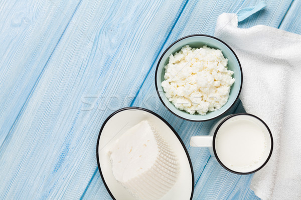 Tejtermékek tej sajt fa asztal felső kilátás Stock fotó © karandaev
