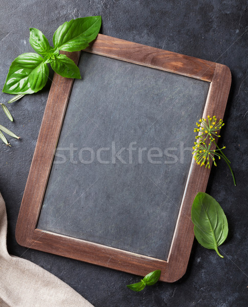 Garden herbs and blackboard Stock photo © karandaev
