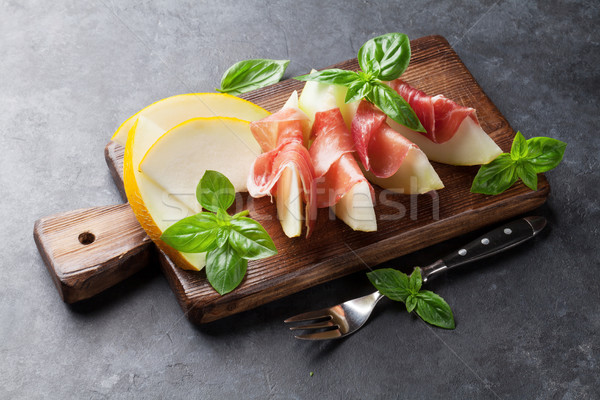 Fresh melon with prosciutto and basil Stock photo © karandaev