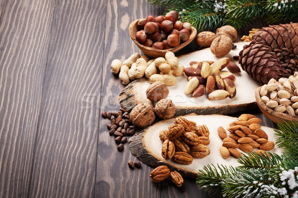 Various nuts on wooden table Stock photo © karandaev