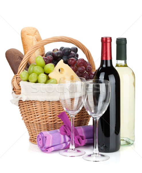 Picnic basket with bread, cheese, grape and wine bottles Stock photo © karandaev