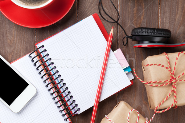 Notepad, smartphone and gift boxes Stock photo © karandaev