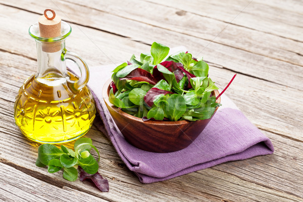 Corn salad leaves and olive oil Stock photo © karandaev