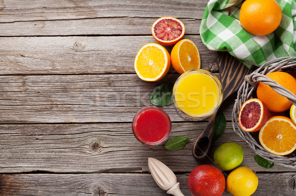 Fresh ripe citruses and juice. Lemons, limes and oranges Stock photo © karandaev