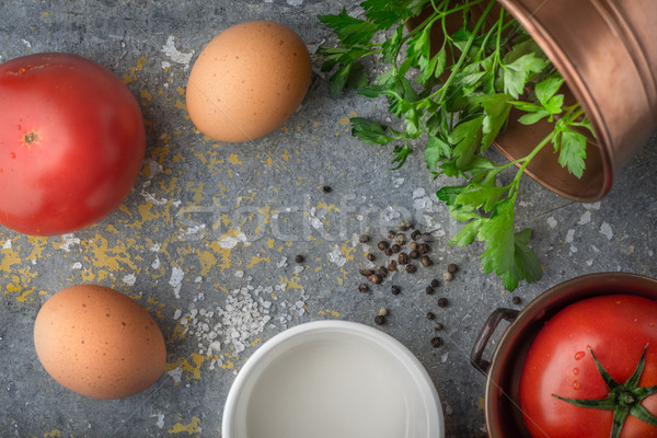 Ingredients for baked eggs with tomatoes  on the stone table top view Stock photo © Karpenkovdenis