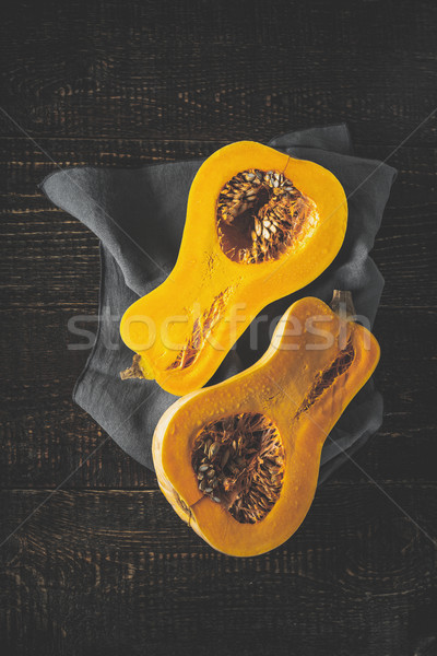 Pumpkin halves on the old wooden table vertical Stock photo © Karpenkovdenis