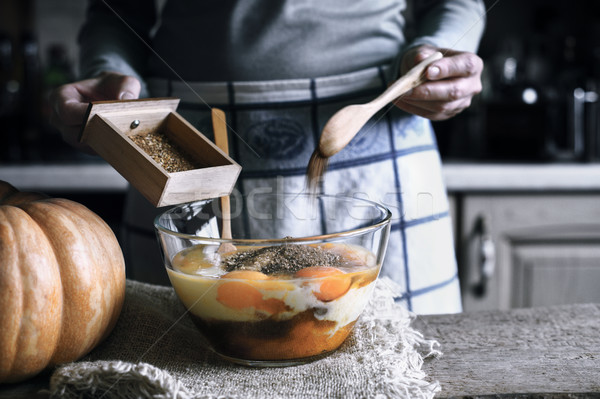 Adding spices in the glass bowl with in the dough for pumpkin dump cake Stock photo © Karpenkovdenis