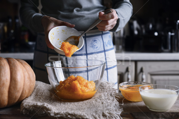 Putting pumpkin puree in the glass bowl horizontal Stock photo © Karpenkovdenis