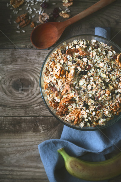 Granola in the glass bowl  on the wooden table top view Stock photo © Karpenkovdenis