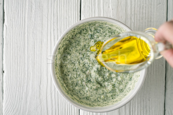 Adding olive oil in tzatziki top view Stock photo © Karpenkovdenis