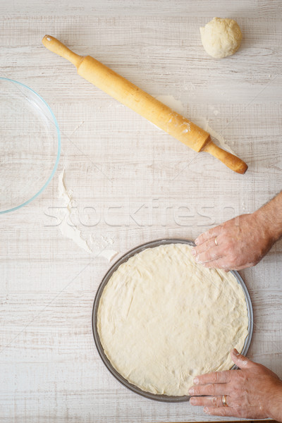 Cooking pizza dough on the wooden table Stock photo © Karpenkovdenis
