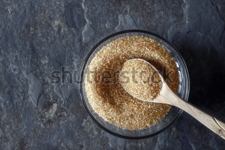 Chia seeds  in the white plate on the dark stone table top view Stock photo © Karpenkovdenis