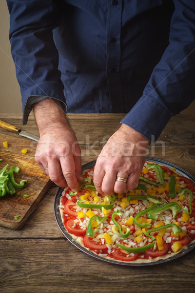 Man makes homemade pizza in the kitchen Stock photo © Karpenkovdenis