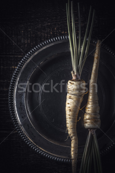 Parsley root  on the old metal plate  vertical Stock photo © Karpenkovdenis
