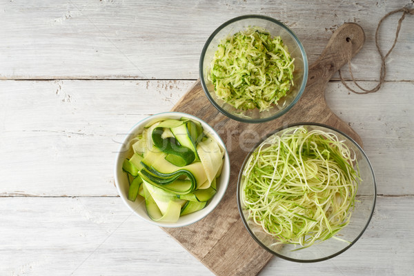 Raw zucchini noodles on the white wooden table top view Stock photo © Karpenkovdenis