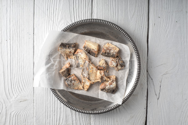 A plate with sardines on wooden table Stock photo © Karpenkovdenis