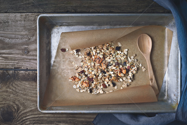 Granola in baking tray on the wooden table top view Stock photo © Karpenkovdenis