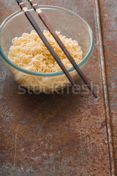 Stock photo: Soup Ramen noodles in glass bowl and wooden sticks