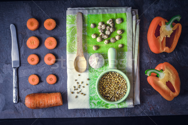 Orange vegetables with seasoning on the dark stone background top view Stock photo © Karpenkovdenis