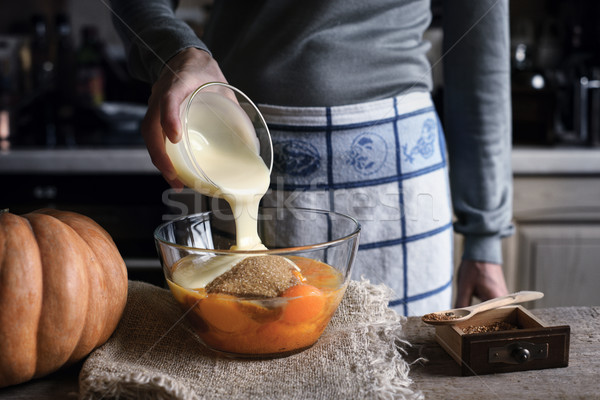 Adding condensed milk in the dough for pumpkin dump cake Stock photo © Karpenkovdenis