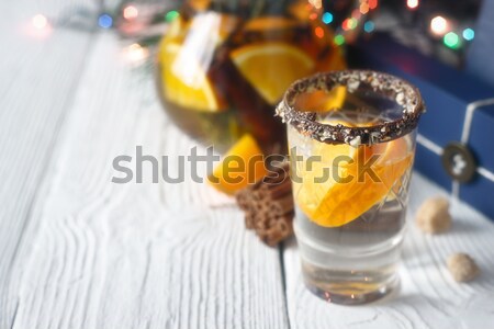 Citrus cocktail in the decorated glass on the white wooden table vertical Stock photo © Karpenkovdenis