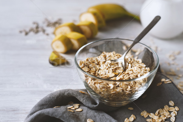 Oat flakes in a glass bowl on the wooden table Stock photo © Karpenkovdenis
