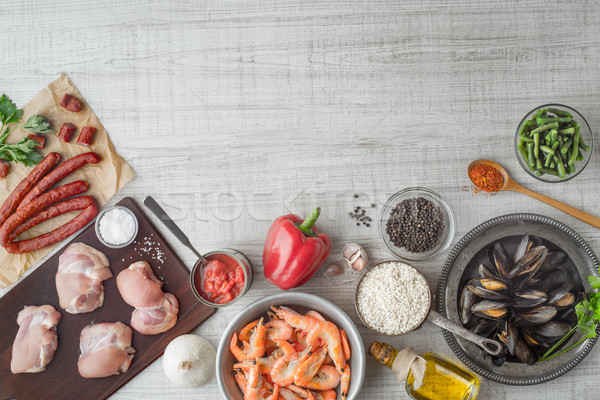 Ingredients for paella on the white  table top view Stock photo © Karpenkovdenis