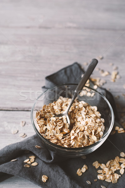 Oat flakes in a glass bowl on the wooden table Stock photo © Karpenkovdenis